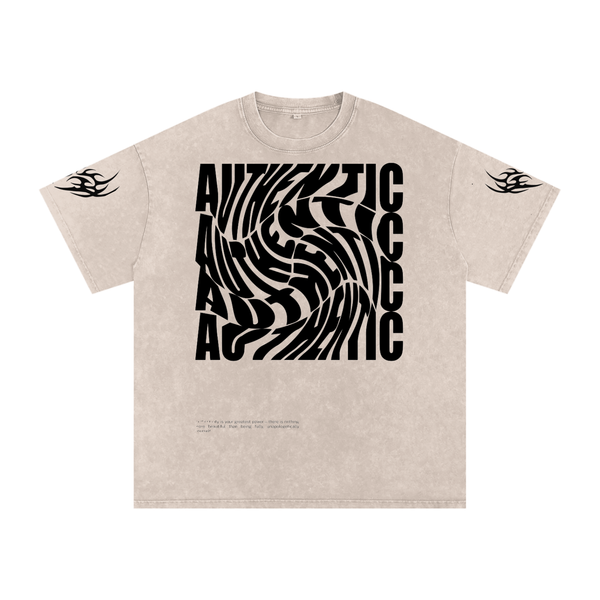 Beige graphic tee with bold 'AUTHENTIC' spiral print and tribal sleeve designs, streetwear style