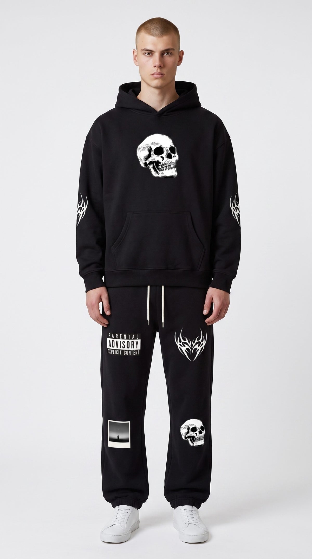 ALTRD Apparel black fleece jogger sweatpants with white graphic skull and text prints on a male model