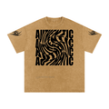 Tan graphic tee with bold 'AUTHENTIC' swirl print and tribal sleeve designs, streetwear style